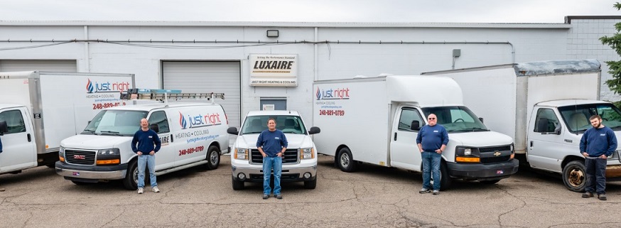 Just Right Heating & Cooling team with fleet in front of Waterford Township office