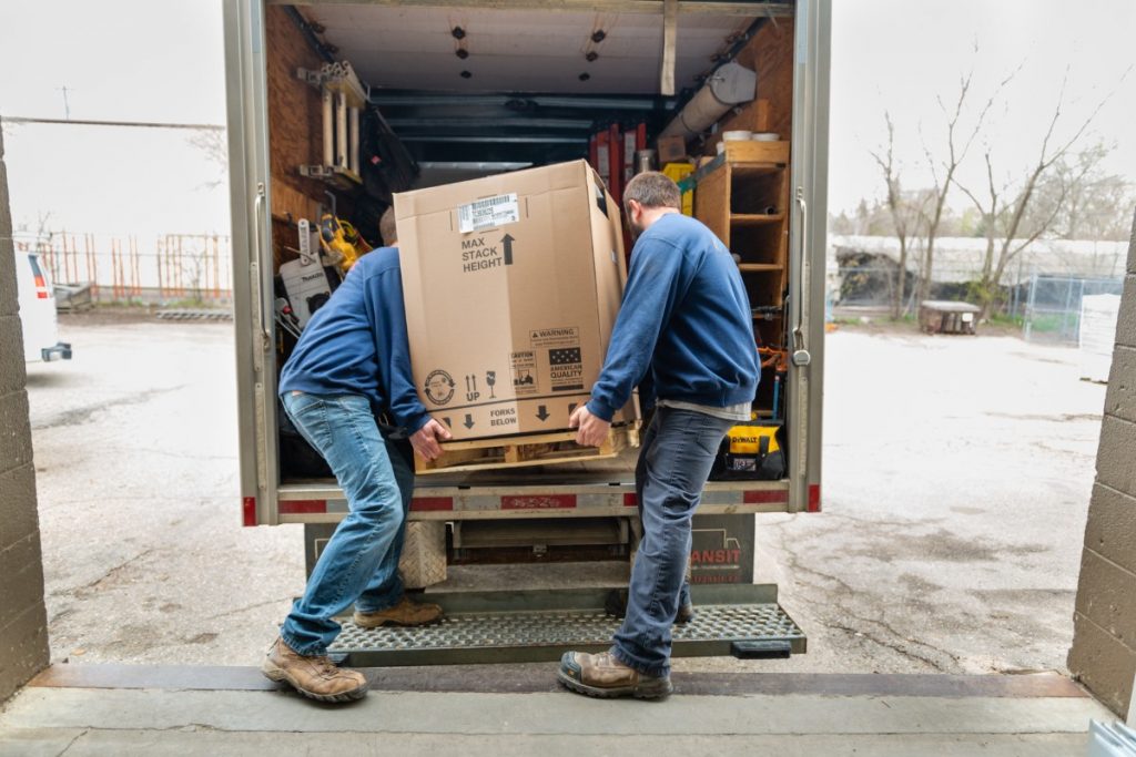 Just Right Heating & Cooling team loading new Luxaire furnace for installation